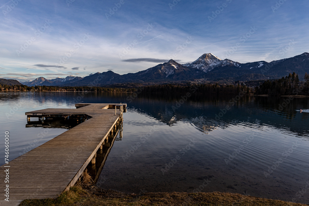 Pier in the reeds on Lake Faaker See, in the Austrian Alps