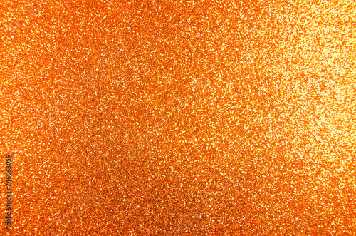 Golden shining glitter background Party concept Shimmering surface New year birthday wedding Glowing Copy space for greeting text Holiday gold orange texture 