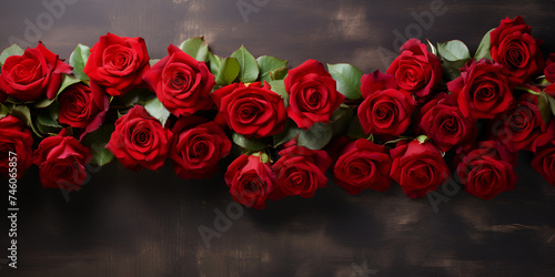 A bunch of red roses with a black background.