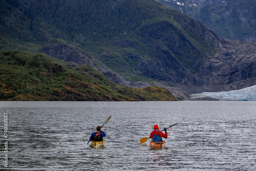 Kayakers paddling across Mendenhall Lake, Juneau, Alaska