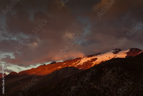 Dramatic color sunset panorama of the Fontana in the Palla Bianca Massif. Mountains popular with hikers and climbers. Vallelunga, Alto Adige, Italy