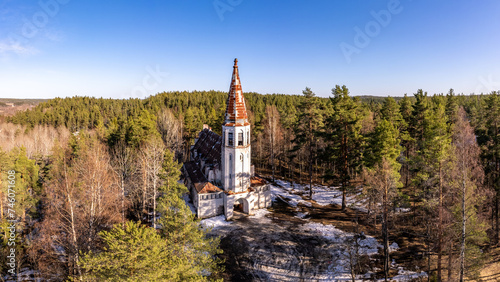 Aerial top view to Finnish Lutheran Church in Lumivaara village. Building in Neo-Gothic style in summer sunny day. Attractions of Lahdenpokh district. Designed architect Adolf Ilmari. Karelia Russia photo