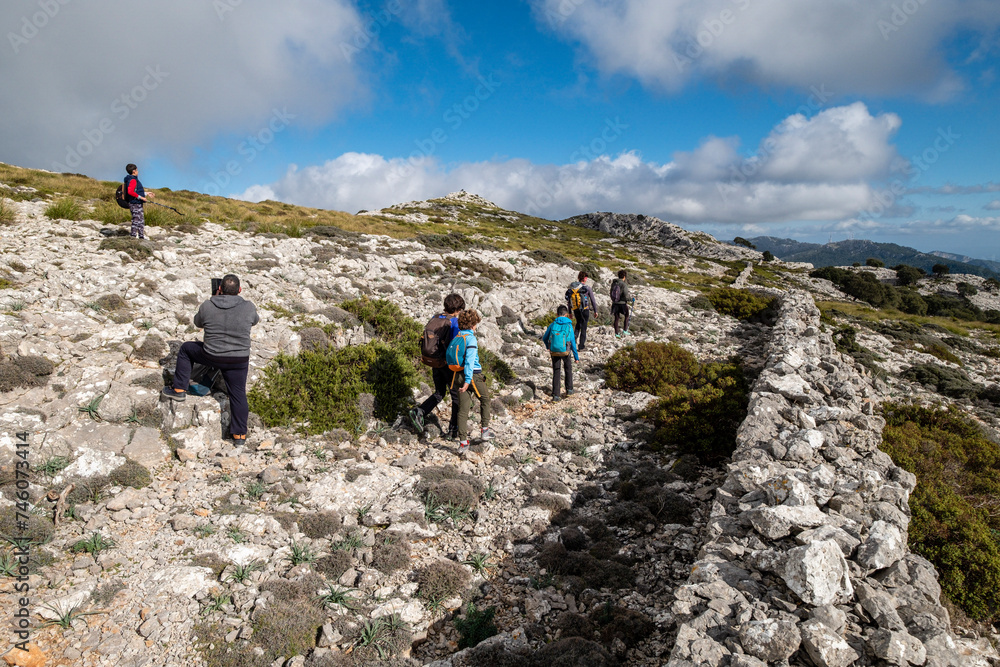hikers ascending through Sierra Son Moragues, Valldemossa, Mallorca, Balearic Islands, Spain