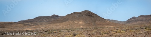 Arid, volcanic landscape of the southern side of Jandia Nature Reserve, Jandia Peninsula, Fuerteventura, Spain