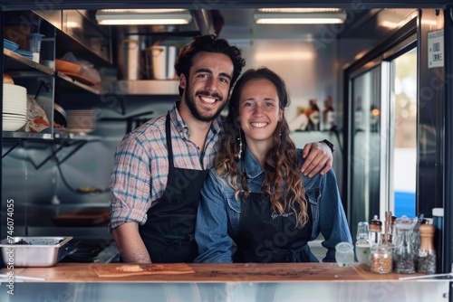Young man and woman working in a food truck