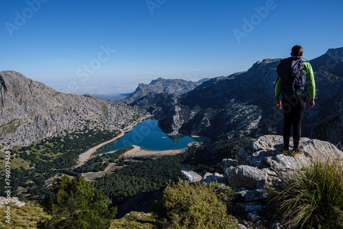 hiker watching Gorg Blau reservoir  Escorca  Mallorca  Balearic Islands  Spain