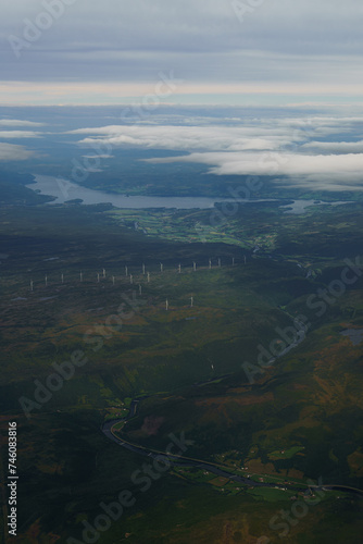Beautiful aerial view of Norway with a Fjord and wind turbinesin the background
