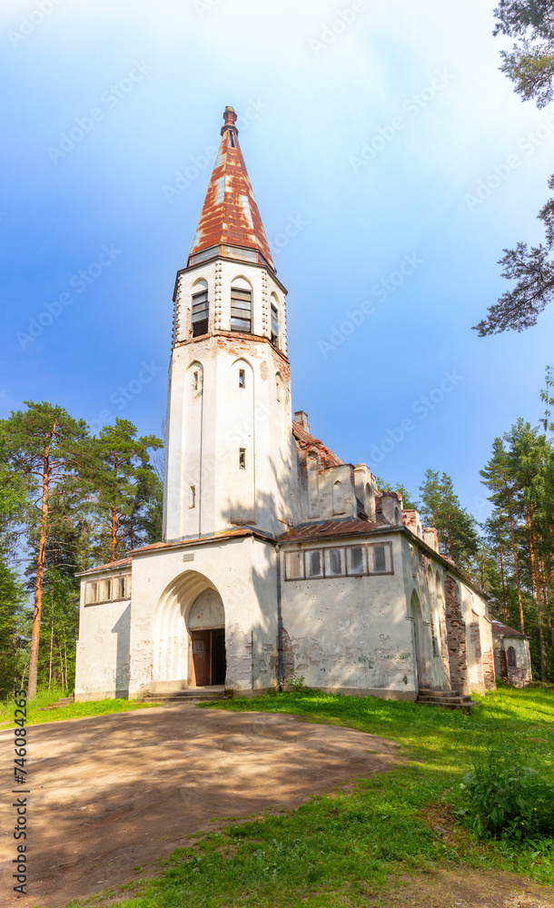 Beautiful view to Finnish Lutheran Church in Lumivaara village. Building in Neo-Gothic style in summer sunny day. Attractions of Lahdenpokh district. Designed architect Adolf Ilmari. Karelia Russia.
