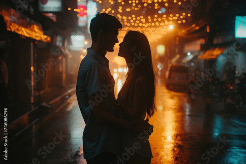 Intimate Moment of a Young Couple Embracing on a Rainy City Night
