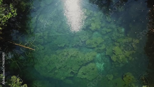 Aerial view of cenote in the middle of the Jungle inside ejido Pino Suarez, Tulum, Riviera Maya, Mexico