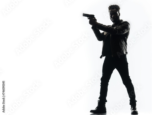 Silhouette of a tough black man holding a gun. Isolated white background with copy space. Private detective. Investigator. Mystery, thriller, action packed pose. Back light. African american man