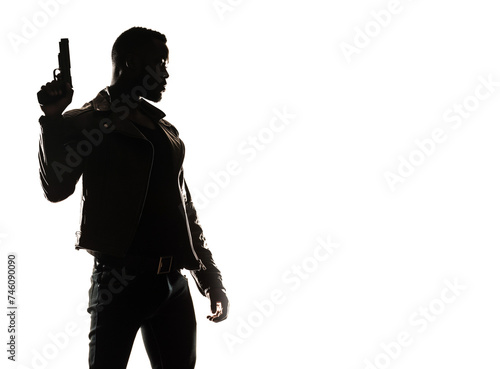 Silhouette of a tough black man holding a gun. Isolated white background with copy space. Private detective. Investigator. Mystery  thriller  action packed pose. Back light. African american man