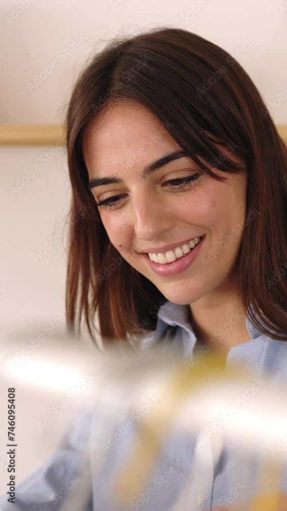Vertical video: Happy young adult female owner checking stock at clothing store. Small business and entrepreneur people concept. Vertical HD video. Vertical video: Happy young adult female owner checking stock at clothing store. Small business and entrepreneur people concept. Vertical HD video.