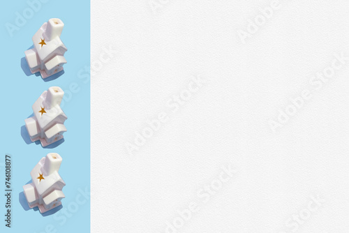order made with 3d white houses lantern on bright blue stripe and white paper with texture. Creative minimal art. Flat lay. Minimal composition. Creative concept with copy space. Border arrangement.