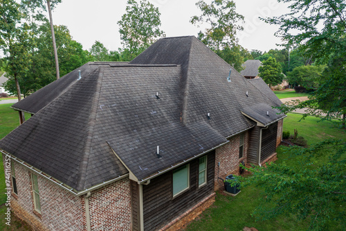 Roof with hail damage and markings from inspection photo