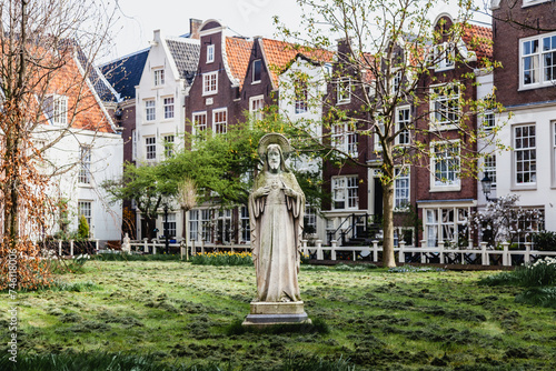 Statue in neighborhood park in The Netherlands, Springtime photo