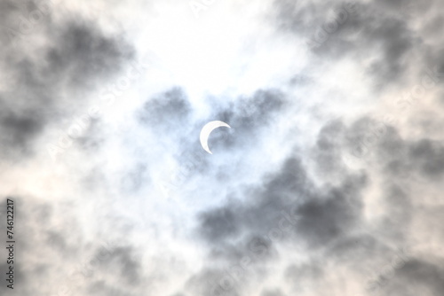 Fototapeta Naklejka Na Ścianę i Meble -  solar eclipse on a cloudy day 