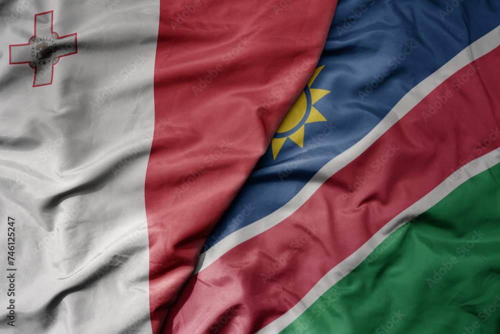 big waving national colorful flag of namibia and national flag of malta.