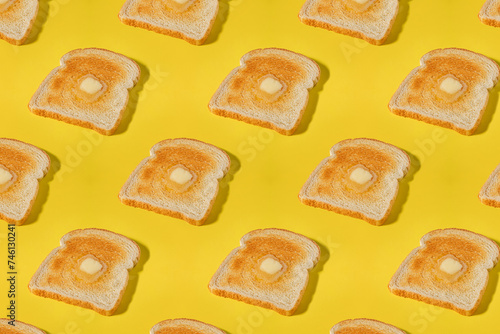 Creative food background, pattern with a slices of toasted bread and butter