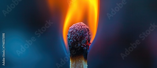 A close-up macro photograph capturing the intense burning of the match head on a matchstick.