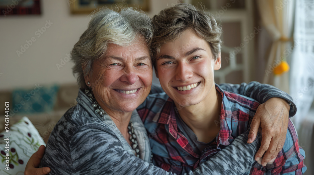 family, generation and people concept - happy smiling senior mother with adult son hugging at home family, generation and people concept - happy smiling senior mother with adult son hugging at home