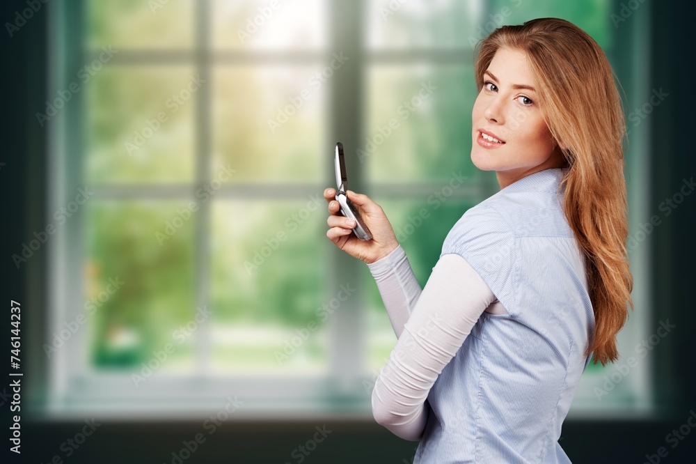 Young teen woman at home by window Young teen woman at home by window