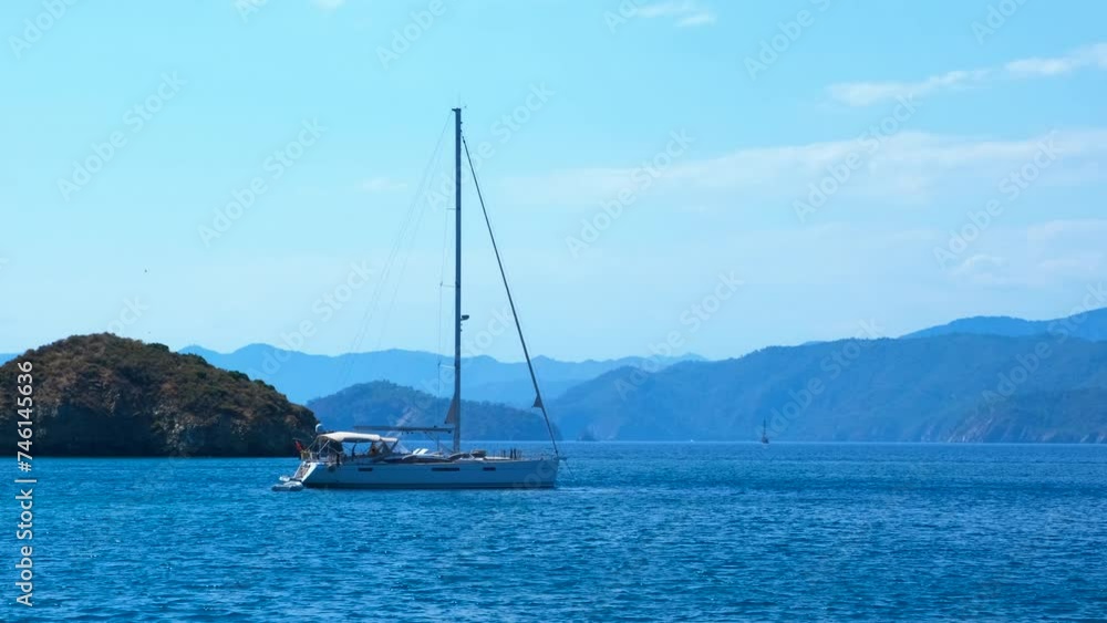 Beautiful yacht have speed cruise. A big white yacht have a slowly trip on turquoise sea waves in summer. Beautiful yacht have speed cruise. A big white yacht have a slowly trip on turquoise sea waves in summer.