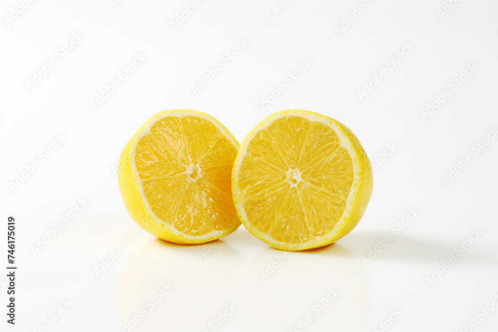 Two fresh lemon halves Two fresh lemon halves