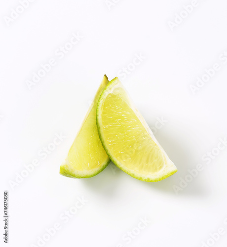 Two lime fruit wedges
