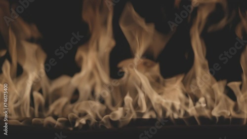 Fire burning. Bright burning flames on a black background. Fire in slow motion. Wall of Real fire, abstract background. Slow motion video, ProRes 422, ungraded C-LOG 10 bit color photo