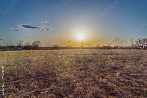 HDR photo of sunset over farmland in early spring