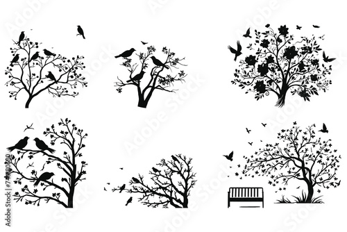 A set of silhouettes of a graceful tree blooming flowers with birds.
 photo