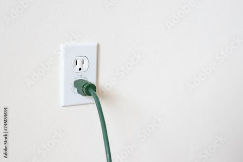 Power cord plugged in. Electrical outlet