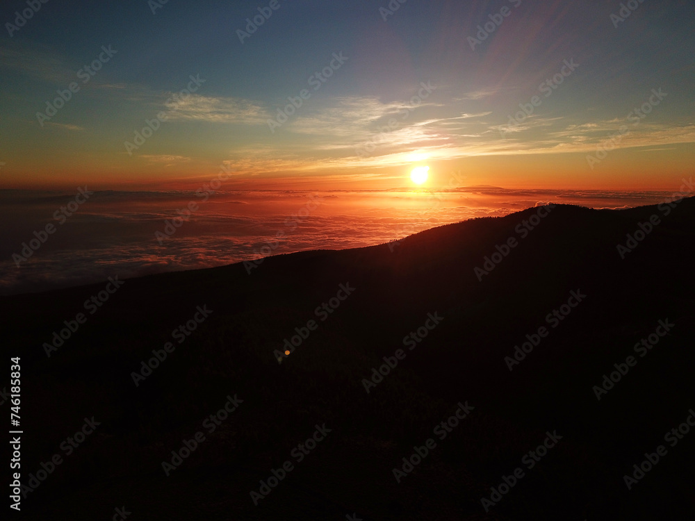 Sunset in the Teide National Park overlooking a sea of clouds under your feet. Tenerife, Canary Islands