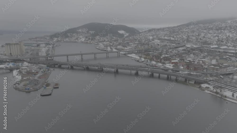 Drone video of Drammen city in Norway during winter. River and railway on a cloudy day. Drone video of Drammen city in Norway during winter. River and railway on a cloudy day.