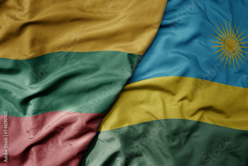 big waving national colorful flag of rwanda and national flag of lithuania .