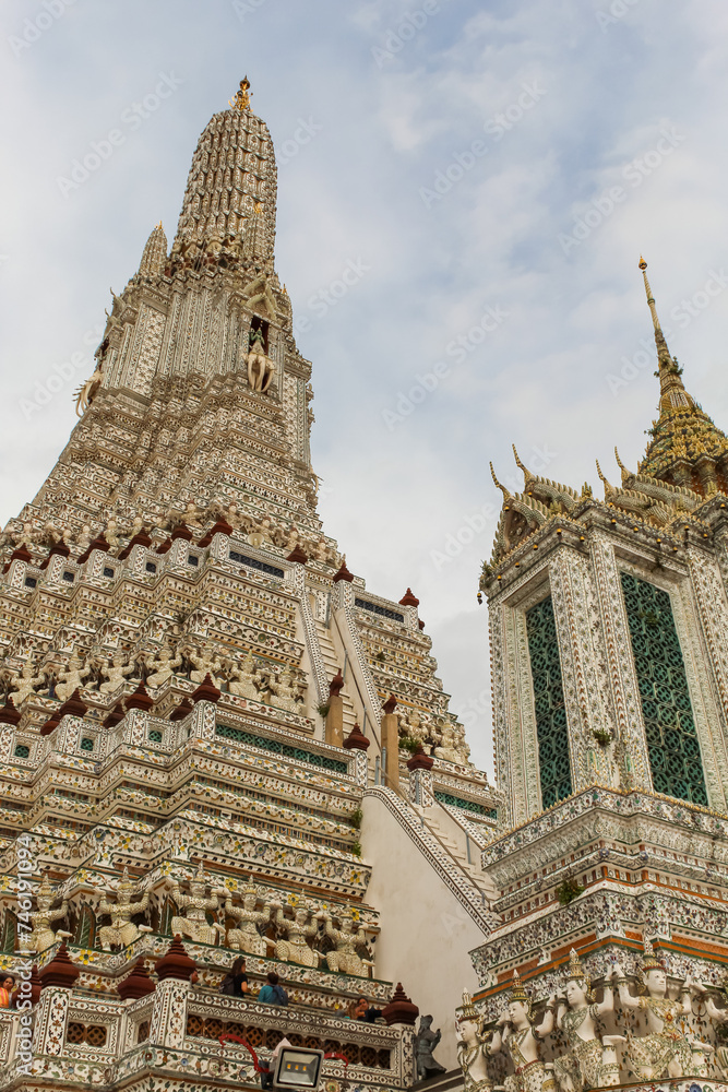 Wat Arun temple in a blue sky in Bangkok, Thailand.