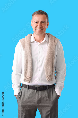 Mature man in shirt on blue...