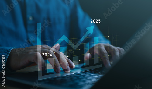 Bilde på lerret Businessman analyzes profitability of working companies with digital augmented reality graphics, positive indicators in 2025, businessman calculates financial data for long-term investments