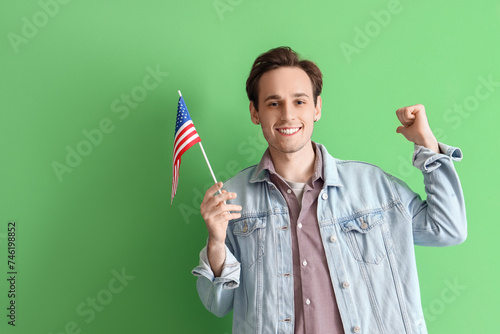 Happy young man with USA fl...