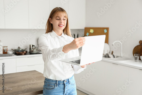 Teenage girl with laptop vi...