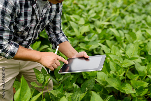 Hands of farmer  Agriculture technology farmer man using tablet Modern technology concept agriculture.