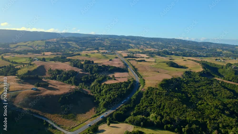 Aerial Drone landscape fly above Chiloe open fields in patagonian chilean travel destination, environmental scene, roads drive through meadow highway Aerial Drone landscape fly above Chiloe open fields in patagonian chilean travel destination, environmental scene, roads drive through meadow highway