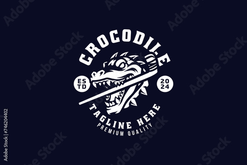 mugger crocodile with hockey stick badge logo design for hockey sport and gaming photo