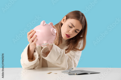 Upset young woman with pigg...