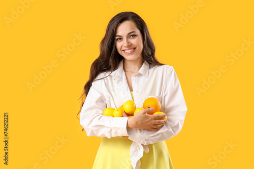 Pretty young woman holding ...