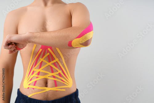 Young man with physio tape ...