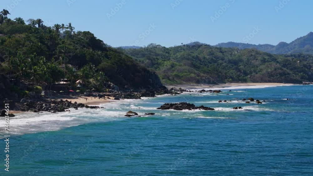 Palya Carricitos in Sayulita Mexico seen by a low flying drone across the water Palya Carricitos in Sayulita Mexico seen by a low flying drone across the water