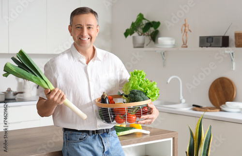 Smiling man holding fresh l...