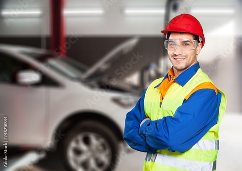 Standing young worker man. Male Auto mechanic